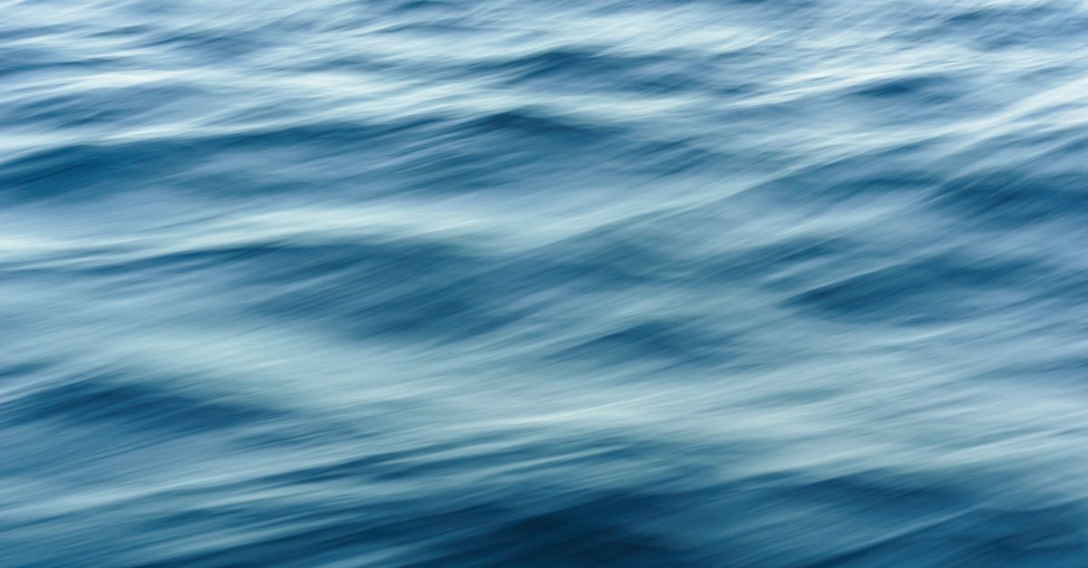 Artistic blur effect of ocean waves capturing fluid motion and dynamic texture.